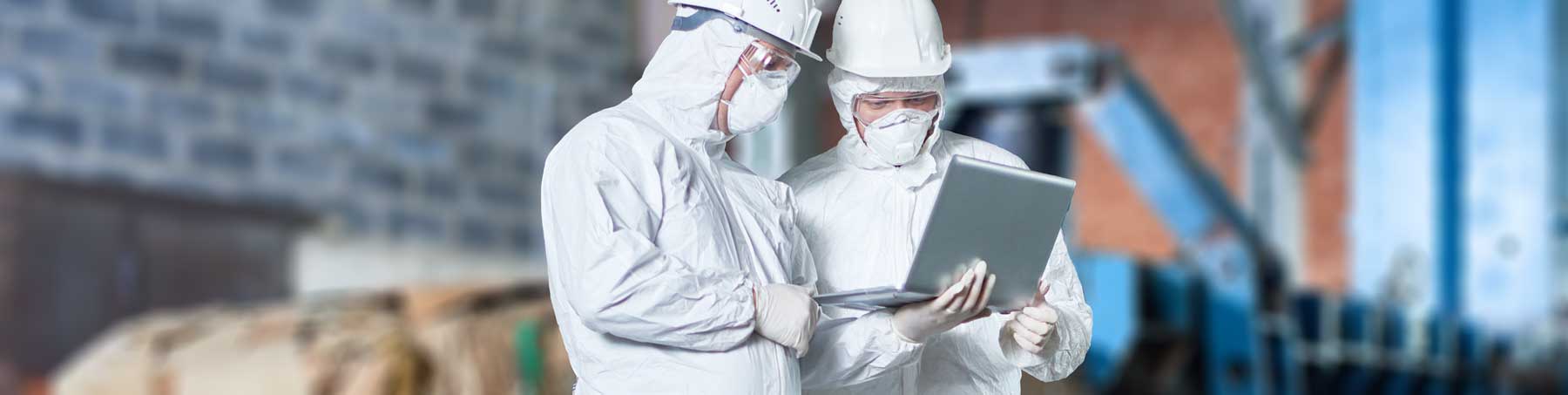 photo of hazmat workers with computer